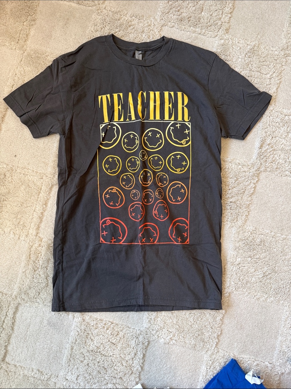 Black 'Teacher' Graphic Tee with Yellow & Red Smiley Design